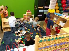 children playing with toys in a play room