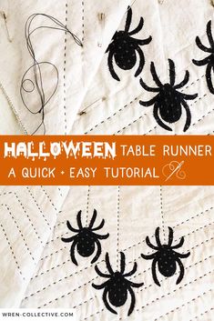 the halloween table runner is easy to make and looks like it has spiders on it