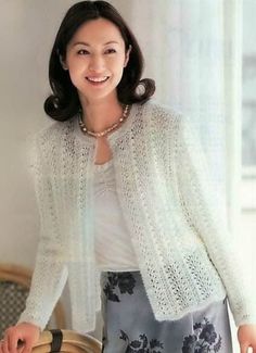 a woman standing next to a basket smiling at the camera