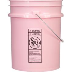 a pink bucket with a stick sticking out of the handle and label stating it is not allowed to use