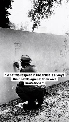 a man writing on the side of a wall with a quote above it that reads, what we respect in the arts is always their battles against their own innovations