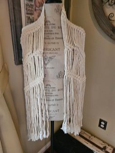 "Beautiful ivory/off white handmade macrame shawl. True older, vintage piece - 73\" in overall total length. The center portion is approximately 44\"  The fringe makes up the remainder of measurements. Width is approximately 12\" without any pull or stretch. It can adjust depending on wear preference. There's a small green spot as shown in the photographs. I've attempted to spot clean and and treat to no avail and appears to be an ink mark but I'm not sure. I don't know if a professional cleaning would remove it. It can be worn so this doesn't show but is still present so please review pictures. Ships safely the following business day." Macrame Shawl, Handmade Macrame, Professional Cleaning, Shawls And Wraps, Scarf Accessory, Macrame, Shawl, Etsy Uk, Pattern