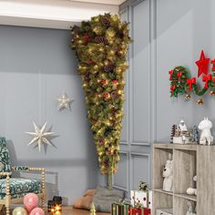 a living room with christmas decorations on the wall