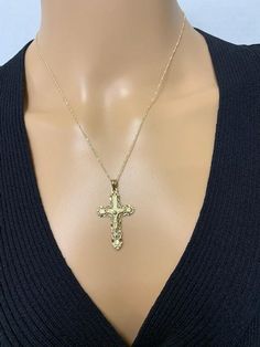 "14K Men's/Women's Crucifix Pendant. Measures approx. 1.5\" in length and 0.75\" in width." Gold Cross Jewelry With Large Pendant, Gold Crucifix Jewelry Stamped 14k, 14k Gold Crucifix Hallmarked Jewelry, 14k Gold Crucifix Jewelry, 14k Gold Hallmarked Crucifix Jewelry, 14k Yellow Gold Crucifix Jewelry, Gold Jewelry With Large Cross Pendant, 14k Gold Crucifix Necklace With Diamond Cut, Gold Diamond Cut Crucifix Jewelry