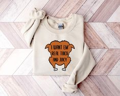 I Want 'Em Real Thick and Juicy Sweatshirt, Thanksgiving Sweatshirt, Thanksgiving Shirt, Fall Sweatshirt, Fall Shirt, Funny Thanksgiving ➤HOW DO I KNOW WHAT SIZE FITS ME BEST To See Our Size Chart, Please Make Sure To Scroll Through The Photos. The Measurements For Our Shirts Are Listed There As Well. These Are A Unisex Fit, So They Will Be Looser If You Order Your Normal Women's Size. For A More Fitted Look, Most People Will Size Down. Please Keep In Mind That Our Size Chart Measurements Are Not in Circumference. ➤EASIEST WAY TO ORDER 1. First, Make Sure That You Have Read All Relevant Information. You Have Scrolled Through All Of The Photos 2. Once That Has Been Completed, Pick Your Shirt Size From First Drop-Down Menu. 3. Next, Pick Your Shirt Color From The Second Drop-Down Menu. 4. Fi Thanksgiving Onesie, Thanksgiving Sweatshirt, Funny Thanksgiving Shirts, Turkey Day, Thanksgiving Shirt, Diy Clothing, Funny Thanksgiving, Fall Shirt, Thanksgiving Shirts