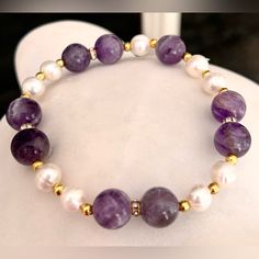 Gorgeous 10mm Amethyst Beads & 7-8mm White Freshwater Pearl With Gold Rhinestone Spacers Stretch Bracelet. Measures 7.5” Inches. New Condition And Comes In A Dust Pouch. Bundle & Save: Bundle 2 Or More Items For A Private Discount Next Day Shipping On All Orders 5 Star Rated Poshmark Ambassador White Amethyst Jewelry With 8mm Beads, White Amethyst Round Bead Bracelets, White Amethyst Beaded Bracelets With Natural Stones, White Amethyst Beaded Gemstone Bracelets, White Amethyst Bracelets With Round Beads, White Amethyst Beaded Bracelets, Elegant Amethyst Crystal Bracelet With 8mm Beads, White Amethyst Gemstone Beaded Bracelets, Elegant Purple Beaded Bracelets With Stones