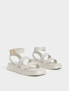 Nothing beats chic strappy sandal that will take you through summer and beyond. Our ankle-strap sandals in a refreshing chalk-white hue make for an incredibly versatile accessory to any workwear or everyday look. The simple yet bold straps lend a hint of edgy cool, while the adjustable ankle buckle ensures a perfect fit. Go for a modern classic effect with a pair of denim jeans, oversized mock top and a classic trench coat. Complete the look with a trapeze top handle bag. White Chunky Sandals, White Sandals Flat, Sandal Outfits, Sandals Aesthetic, Charles And Keith Shoes, Sandals Design, Shoes Png, Trapeze Top, White Flat Shoes