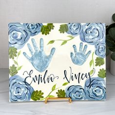 a handprinted sign with blue roses on it