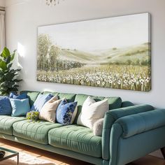 a living room filled with furniture and a painting on the wall