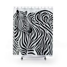 a black and white shower curtain with a zebra's head on the back of it