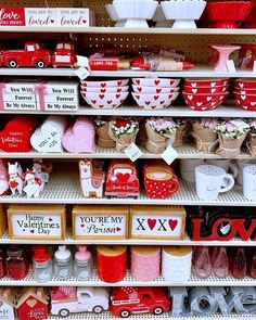 valentine's day items are on display in a store, including mugs and bowls