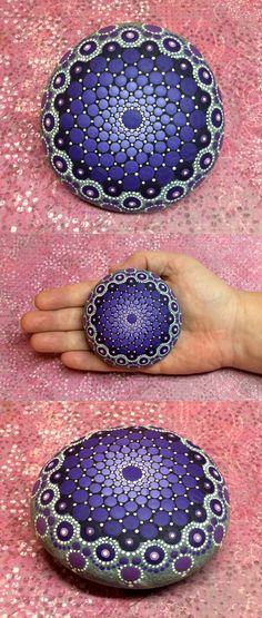 the hand is holding two purple and white circular cushions on pink fabric with circles around them