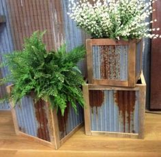 two wooden planters sitting next to each other