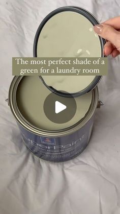 the most perfect shade of a green for a laundry room is being used to paint