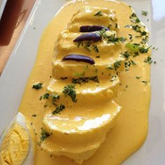 a white plate topped with food on top of a table