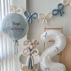 balloons and decorations are displayed on a table