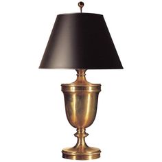 a gold lamp with a black shade on it