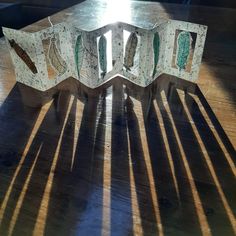 an open book sitting on top of a wooden table