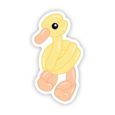 a yellow duck sticker sitting on top of a white surface