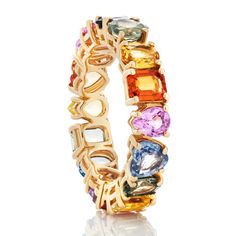 an 18k yellow gold ring with multicolored stones and the word love written on it