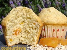 two muffins sitting next to each other on top of a table