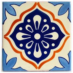 a blue and white tile with orange accents