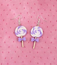 "Hi CutiePie, We're funny lollipop earrings. We're earrings created from polymer clay without using any molds and completely handmade. We can be a funny gift for people of all ages. We'll always cheers You up and will bring a smile on your face. Our dimensions are: Length 1.6\" ( or 4 cm. ) Width 0.8\" ( or 2 cm. ) But I can also be made as necklace, a brooch or a keychain. My dimensions as keychain: Length 1.8\" ( or 4.5 cm. ) Width 1\" ( or 2.5 cm. ) My dimensions as necklace: Length 1.8\" ( o Gay Earrings, Menhera Aesthetic, Lollipop Earrings, Ariana Perfume, Earrings Funny, Candy Earrings, Autumn Earrings, Purple Candy, Food Charms