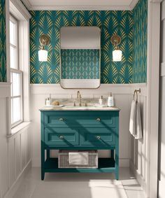 a bathroom with blue vanity and green wallpaper