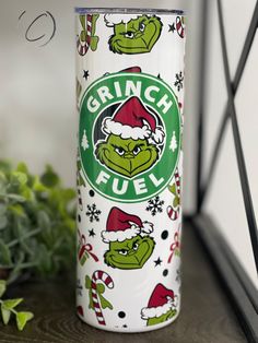 the grinch fuel can is decorated with santa hats and candy canes