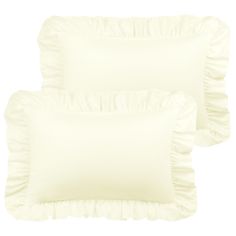 two white pillows with ruffles on them