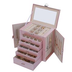 an open pink jewelry box with several compartments