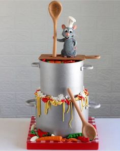 a cake made to look like a mouse cooking