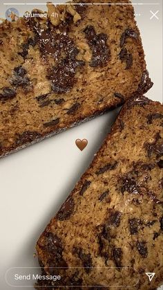 three pieces of cake sitting on top of a white plate next to a heart shaped cookie