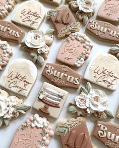 decorated cookies with names and flowers on them for a bridal party or baby shower