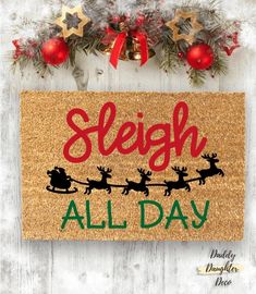 a door mat that says sleigh all day with santa's sleigh