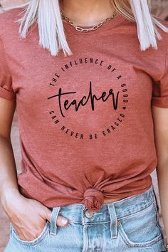 Introducing "The Influence Of A Good Teacher Can Never Be Erased" Heart Graphic Tee from Kissed Apparel. Elevate your merchandise with this impactful and meaningful design. Most t shirt colors are 52/48 cotton/poly blend. White and Cream tees are 100% cotton, Ash tees are 99/1 cotton/poly. Perfect for celebrating the lasting impact of teachers. Order now to enhance your back to school line and captivate customers with this inspiring and heartfelt tee.Made In: USAFabric Contents: Most t-shirt col T Shirt Colors, Good Teacher, Wedge Heel Sneakers, Usa Shoes, Meaningful Design, Pink Canvas, Heart Graphic, Rose Boutique, Usa Dresses