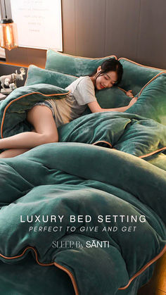 a woman laying on top of a bed covered in green comforter and pillows with the words luxury bed setting perfect to give and get