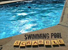 a swimming pool with scrabble written on it