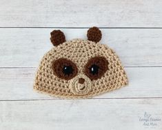 a crocheted bear hat with brown ears