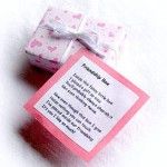 a small pink gift box with a poem on it