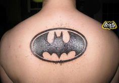 batman symbol tattoo on the back of a man