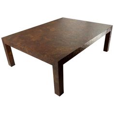 a brown table sitting on top of a white background