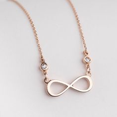 "Buy a unique Infinity necklace in 14 karats gold for women. | Discover a large collection of everyday sparkling jewels. | ✅ We offer FREE Worldwide Shipping. Infinity Forever Design necklace with sparkling CZ stones in rose gold. The modern design allows the sentiment of the necklace to really shine through. Every time you offer someone an infinity-shaped pendant you are indicating that your friendship/love will have no end and will go on forever. It really has a powerful message and sure it wi Long Distance Family Gifts, Bestie Necklace, Gold Infinity Necklace, Infinity Symbol Necklace, Simple Necklace Everyday, Infinity Necklace Gold, Eternity Symbol, Unbiological Sister, Necklace Infinity