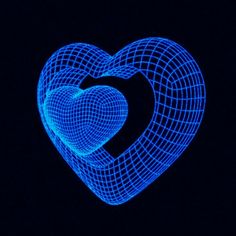 a blue heart shaped object in the dark