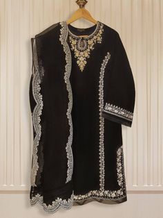 ﷽ Shop: fazcollectionoriginal AsalaamuAlikum/ Hi all Material Description: Shirt: Pure Velvet  Duppatta: Pure Organza  Trousers: Raw Silk  Size: Large Price: £120 Delivery: £5.00 Contact details: 07852779686 Www.fazcollection.co.uk  I have the biggest Collection of Original Agha Noor outfits and kurtas only in stock. All ready to dispatch immediately. Please note that there will be slight colour differences due to high lighting and photo touch-ups. OUR REFUND POLICY Goods, once sold, will not be taken back unless they are defective. Shipping charges can not be refunded. However, all refunds will be evaluated on a case to case basis. In case the product has to be returned, the buyer will bear the cost of sending it back. Black Semi-stitched Palazzo Set With Mirror Work, Elegant Black Kurta With Dupatta, Fitted Black Salwar Kameez With Mirror Work, Elegant Black Palazzo Set For Festive Occasions, Black Designer Sets With Mirror Work, Black Unstitched Sharara For Eid, Unstitched Black Sharara For Eid, Elegant Black Dupatta For Eid, Black Traditional Wear With Dabka Work For Party