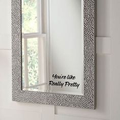 there is a mirror with the words you're like really pretty on it