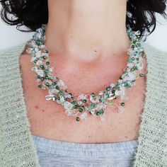 Green handmade multi strand beaded necklace with crystals, Royal Crystal chips and more than 50 Swarovski. This statement necklace has six very resistant transparent nylon's strands crocheted with iridescent green Swarovski, light green and traspèarent crystals and Clear Quartz chips. Strands are not rigid, but softly adapt to the shape of the neck. This choker necklace is very light and comfortable to wear. It suits very well both to elegant women and young adult girls. The small parts, the clo Multi-strand Crystal Beaded Necklace For Gift, Necklace With Beads, Multi Strand Beaded Necklace, Crystal Chips, Iridescent Green, Multi Strand Bracelet, Round Necklace, Bridesmaid Necklace, Bead Jewellery