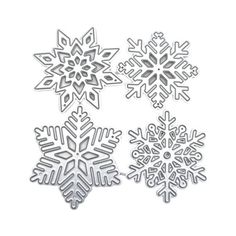 three snowflakes cut out from paper