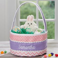 an easter basket filled with stuffed animals and candy