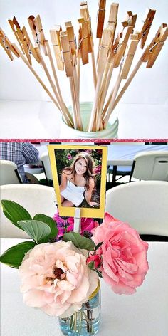 a vase filled with flowers sitting on top of a table next to a photo frame